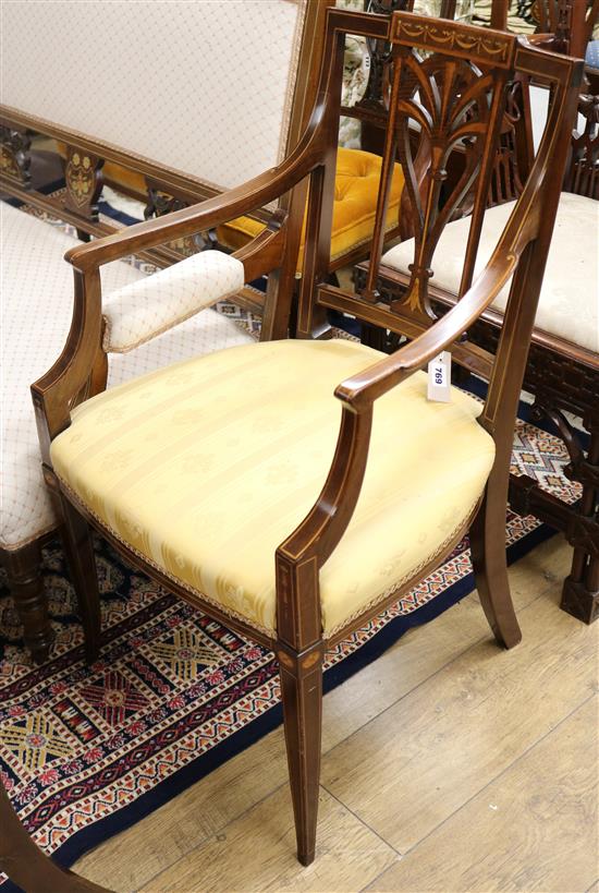An Edwardian marquetry elbow chair